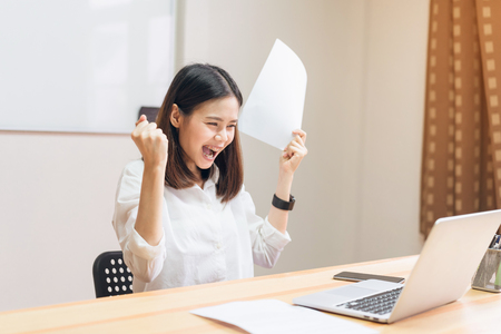 Business women fists being excited of success expressed joy because they work to achieve her goals.の写真素材
