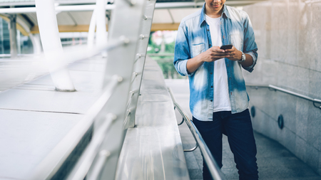 Man holding a smartphone. using cell phone on lifestyle. Technology for communication concept.の写真素材