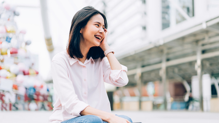 Portrait of young woman happy and smiling.の写真素材