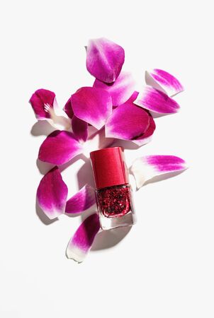 Nail polish of beautiful red colors on white background.の写真素材