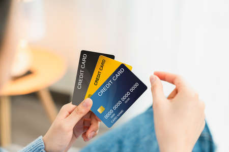 Hand holding credit card and pick take to shopping.