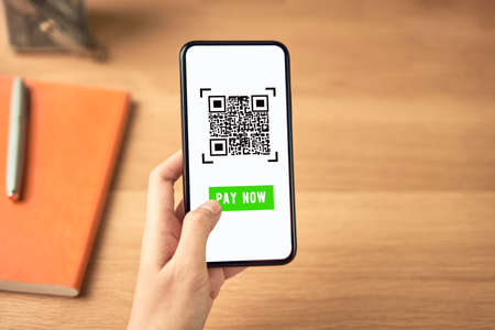 Woman using smartphone for qr code payment mobile banking on application wallet.の写真素材