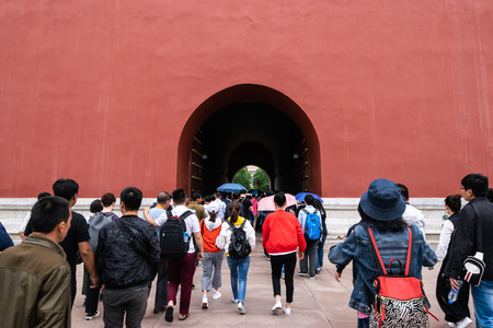 Beijing, China -May 20, 2018:View of people walking to travel  trough the tunnel gate at Forbidden city which is a palace complex in central Beijing, China.のeditorial素材