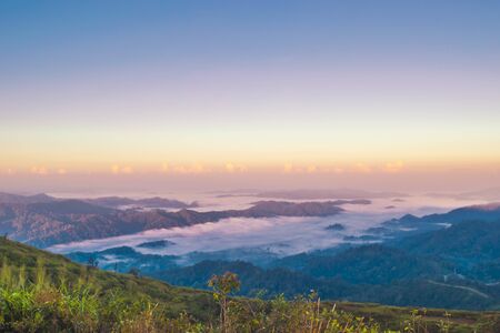 Top view of mist clouds on the mountain of Nern Chang Suek peak at E-Thong village, Pilok,Thong Pha Phum National Park, Kanchanaburi province, Thailand.の写真素材