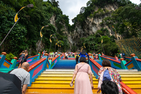 Selangor, Malaysia - December 8, 2018: View of travelers clime up to the top of Batu Caves, where is a limestone hill that has a series of caves and cave temples, in Selangor, Malaysia.のeditorial素材