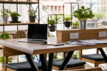The blurred background of green modern office interior for good environment working