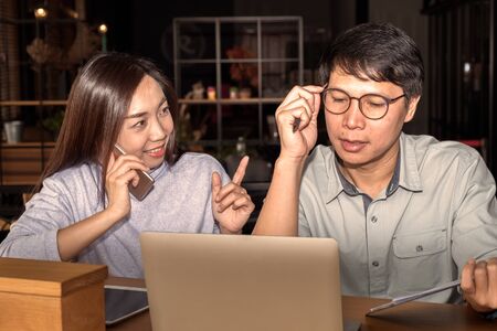 Young generation of Asian businessman and businesswoman are discussing work together in the modern...