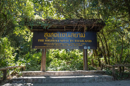 Chiang Mai, Thailand - February 22, 2019: View of the highest spot in Thailand 2,565.3341 meters above mean sea level wooden sign at Doi Inthanon national park in Chiang Mai, Thailand.のeditorial素材