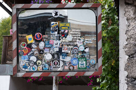 Hallstatt, Austria - October 6, 2019: View of a man taking reflecting photo from the mirror at Hallstatt village on Hallstattersee, a  famous romantic place European travel destination in Austria.のeditorial素材