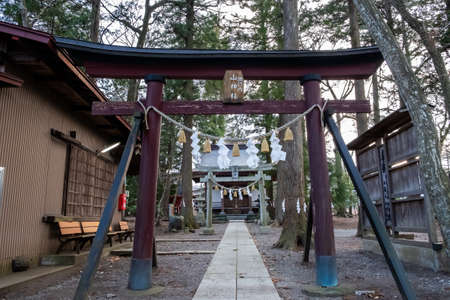 Yamanashi, Japan - March 22, 2019: View of the Torii gate into Yama shrine, a small standalone shrine on a mountain nearby Mt. Fuji Station in Yamanashi, Japan.のeditorial素材