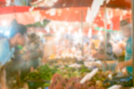 Blurred background of Traditional street foods in Kad Luang night market in Chiangmai province,...