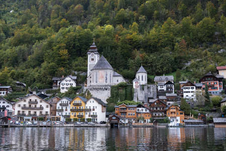 Hallstatt, Austria - October 6, 2019: View of Hallstatt village on Hallstatter See Lake in High Alps Mountains, a  famous romantic place European travel lakeside destination in  Upper Austria, Austriaのeditorial素材
