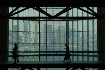 Doha, Qatar - October 13, 2019: The cityscape shadow view through the glass window from Museum of...
