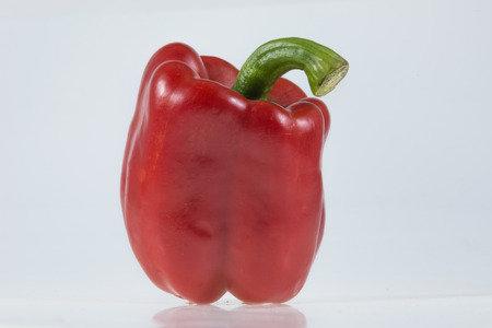 Red bell peppers isolated on white background.