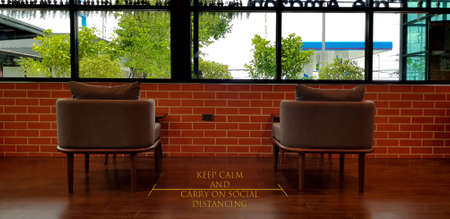 Social distance concept. keep spaced between each chairs make separate for social distancing, increasing physical space between people to avoid spreading illness during transmission of COVID-19の写真素材