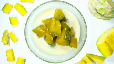 Many chocolate chips are on gray abstract background. Background with chocolate. Slices of chocolate Sweet food photo concept. Copyspaceの写真素材