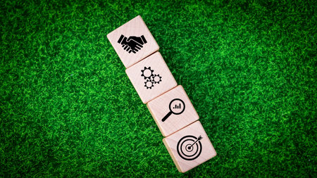 Businessman holding block cube with icon success of business. Purpose of doing business overcoming...