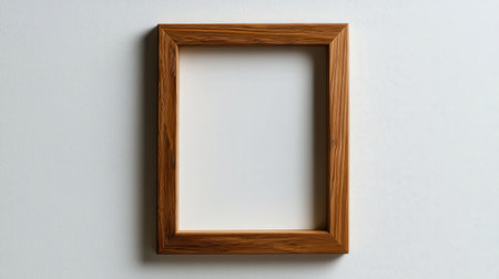 Simple wooden frame isolated on white background, perfect for photography or graphic designsの素材