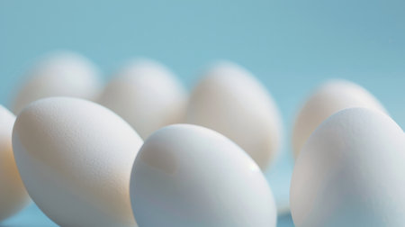 White eggs on a blue background.の素材