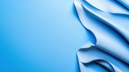 A blue background with a white fabric that is folded in half. The fabric is folded in such a way that it looks like it is being pulled apartの素材