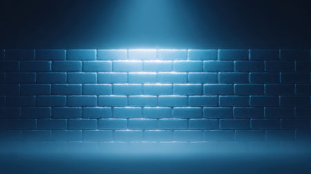 A blue brick wall with a light shining on it. The light is shining on the wall and creating a shadowの素材