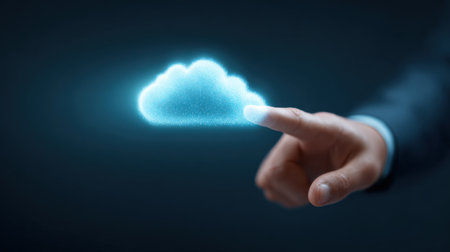 A man is pointing at a cloud with his finger. The cloud is glowing and he is a symbol of technology or innovationの素材