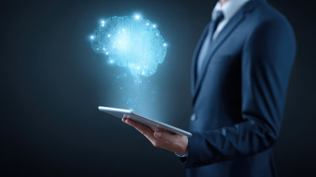 A man is holding a tablet with a brain on it. Concept of intelligence and technological advancementの素材