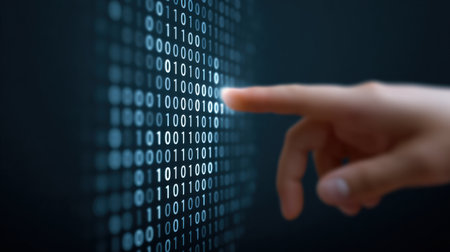 A hand is pointing at a series of binary numbers on a screen. Concept of precision and control, as the hand is focused on the numbers and he is guiding the viewer's attention to a specific pointの素材