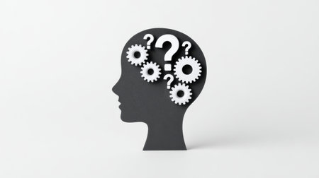 A black and white drawing of a person's head with a question mark on itの素材