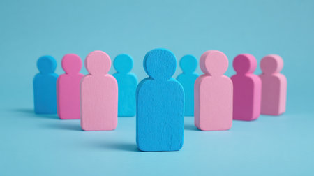 A group of people are standing in a circle with a blue person in the middle. The blue person is the only one that is not pink or purpleの素材