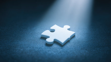 A white puzzle piece is on a blue surface. Concept of mystery and curiosity, as the puzzle piece is the only visible object in the scene. The blue background adds a sense of depthの素材