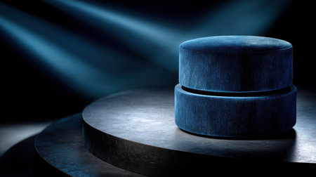 A blue object with a blue surface sits on a black surface. The blue object is round and has a shiny surfaceの素材