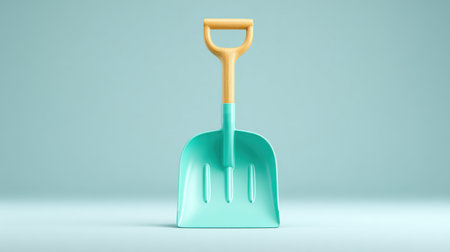 A blue plastic shovel with a wooden handle. The shovel is sitting on a blue surface. The shovel is not in useの素材