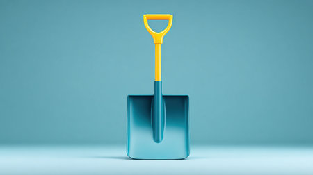 A blue and yellow shovel is standing upright on a blue background. The yellow handle is the only thing that is not blueの素材