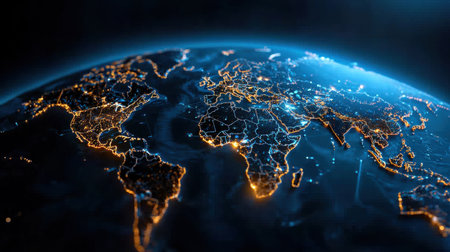 A globe with the continents of Africa, Europe, and Asia lit up in the dark. Concept of unity and interconnectedness among these continentsの素材