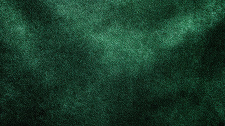 A green fabric with a lot of glitter on it. The fabric is very shiny and has a lot of sparklesの素材