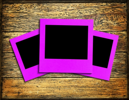 photo frame on wood backgroundの写真素材