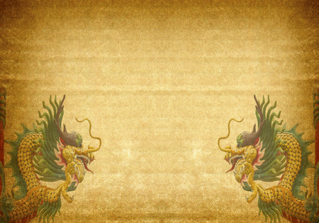 Dragon statue on old paper backgroundの写真素材