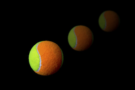 Tennis ball on black backgroundの写真素材