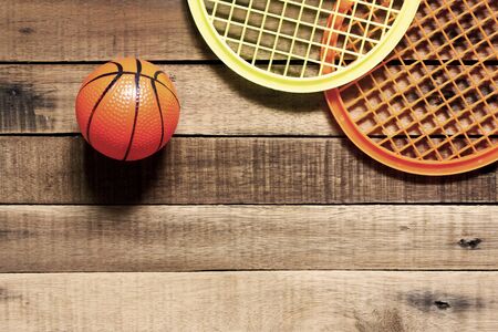 Tennis ball and Racket on wood background .の写真素材