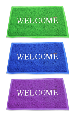 doormat of welcome text on white background.の写真素材