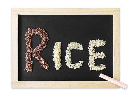 rice seed on a blackboard isolated white background.の写真素材