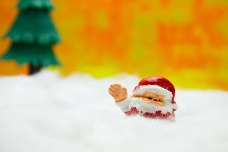 Santa cross doll and Christmas tree and Snow. Concept Christmas Day.