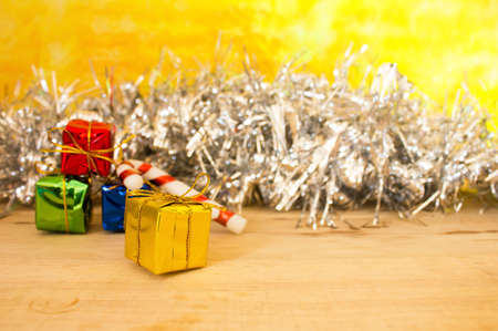 Christmas gift box. Christmas presents in gold boxes at wooden table. Flat lay with copy space.