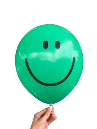 Green  balloon isolated on white background. Party decoration for celebrations and birthday.の写真素材