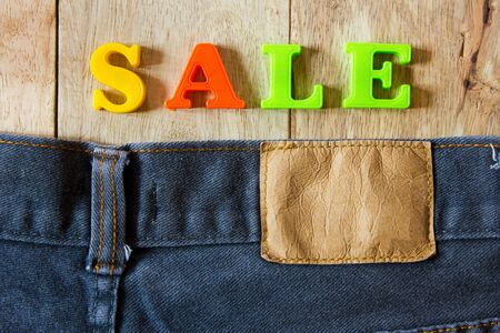  jeans on old wooden surface background, empty space for texture.の写真素材