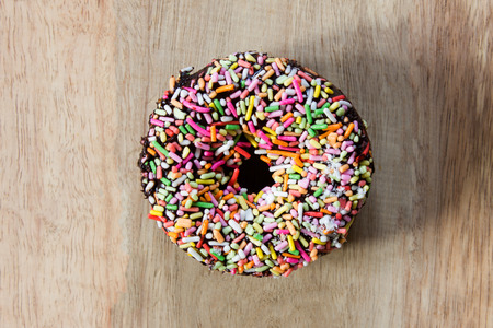 Donuts on a wooden background. Free space for text. Top view.の写真素材