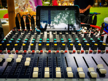 Slide the volume control of the audio mixer for studio music.の写真素材