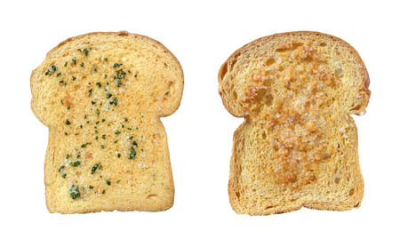 Garlic and herb bread slices isolated on white backgroundの写真素材