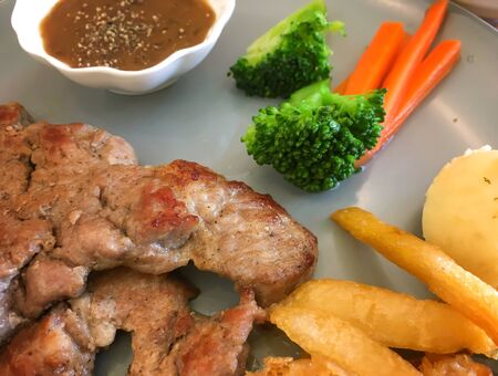 Steak, Mash potato, Vegetable, Sauce, on plateの写真素材